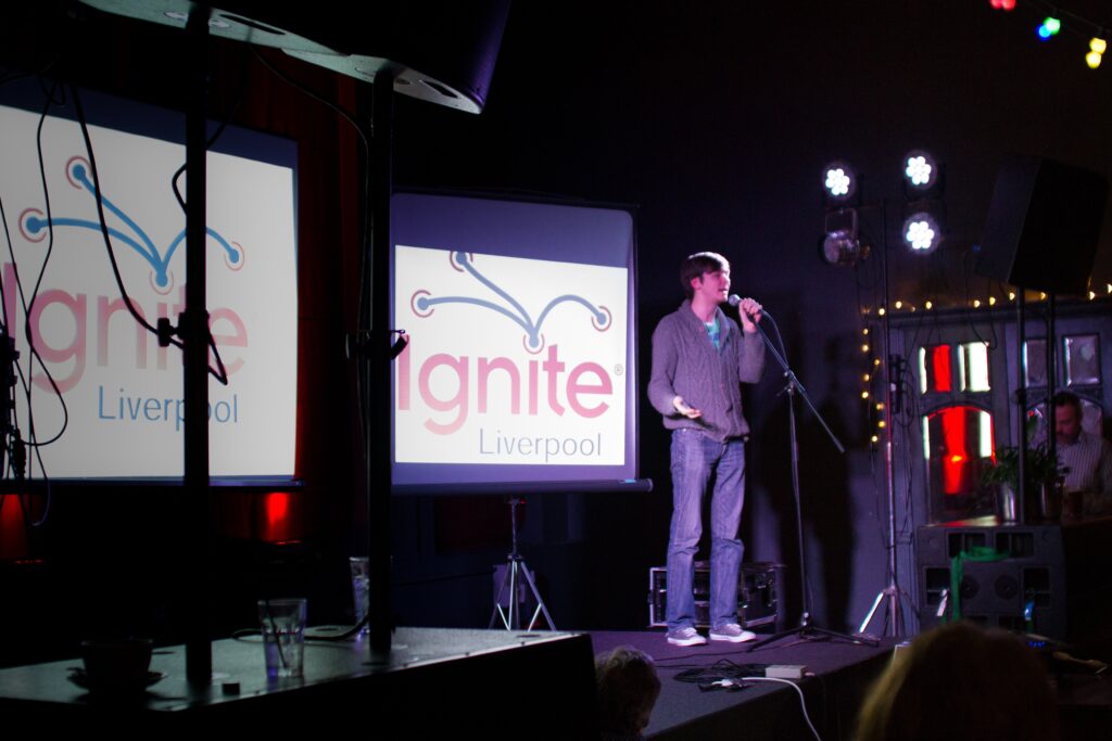 A speaker on stage at Ignite Liverpool